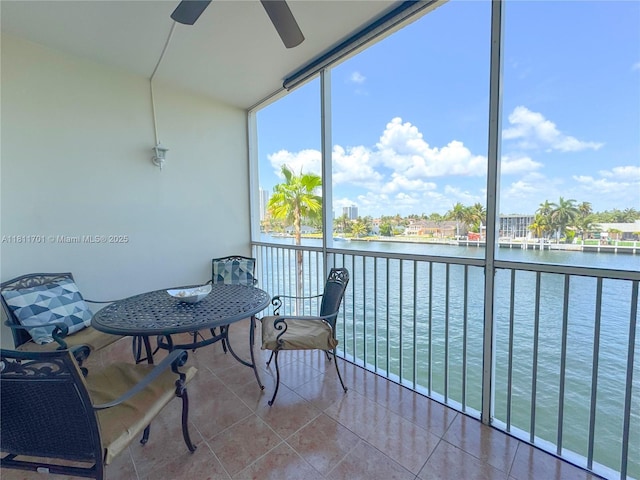 2097 S Ocean Dr Unit 302, Hallandale Beach, FL 33009 - sunroom with a ceiling fan, a water view, and plenty of natural light