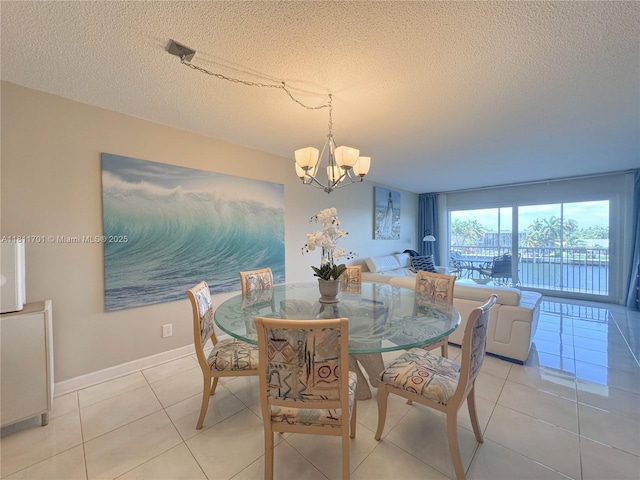2097 S Ocean Dr Unit 302, Hallandale Beach, FL 33009 - dining room featuring a chandelier, a textured ceiling, light tile patterned flooring, and baseboards