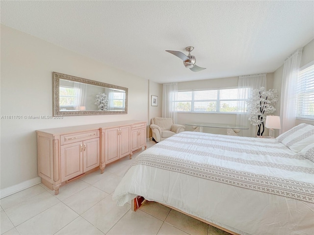 2097 S Ocean Dr Unit 302, Hallandale Beach, FL 33009 - bedroom featuring multiple windows, a textured ceiling, light tile patterned floors, and ceiling fan