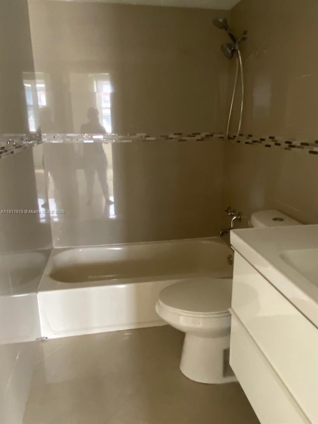 3660 NE 166th St Unit 115, North Miami Beach, FL 33160 - bathroom featuring toilet, shower / bathtub combination, vanity, and tile patterned floors