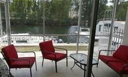 3660 NE 166th St Unit 115, North Miami Beach, FL 33160 - sunroom / solarium with a water view