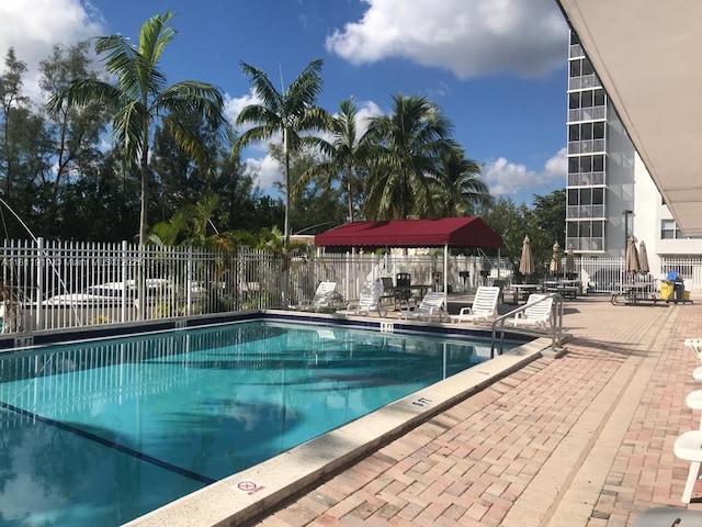 3660 NE 166th St Unit 115, North Miami Beach, FL 33160 - community pool with a patio area