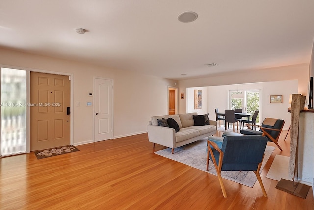 5620 Alhambra Cir, Coral Gables, FL 33146 - living area featuring light wood-style floors and baseboards