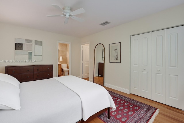 5620 Alhambra Cir, Coral Gables, FL 33146 - bedroom with wood finished floors, baseboards, a closet, ensuite bath, and ceiling fan