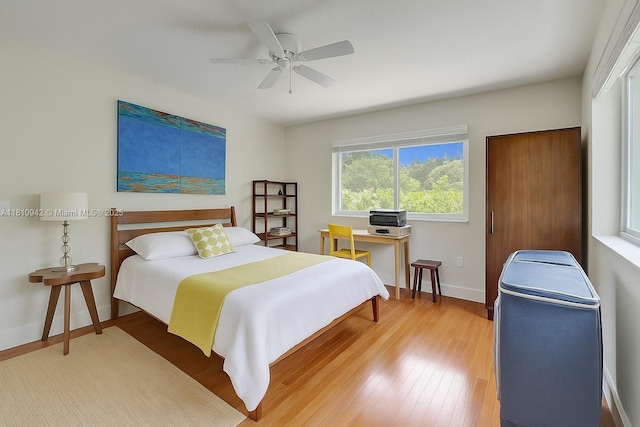 5620 Alhambra Cir, Coral Gables, FL 33146 - bedroom featuring light wood-style flooring, baseboards, and a ceiling fan