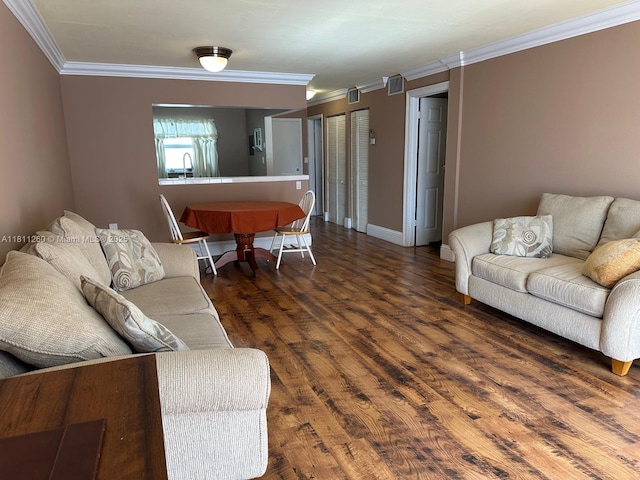 4000 NE 169th St Unit 405, North Miami Beach, FL 33160 - living area with crown molding, wood finished floors, and baseboards