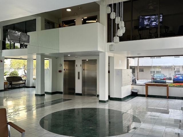 4000 NE 169th St Unit 405, North Miami Beach, FL 33160 - common area with a towering ceiling and recessed lighting