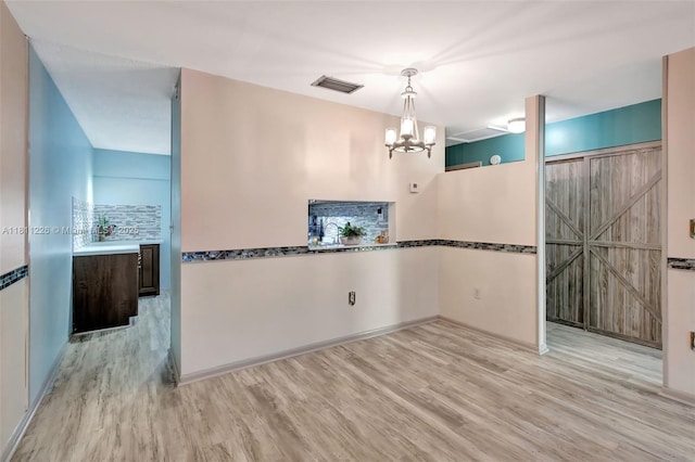 2001 Seagrape Ave, Pembroke Pines, FL 33026 - unfurnished dining area with wood finished floors and a chandelier