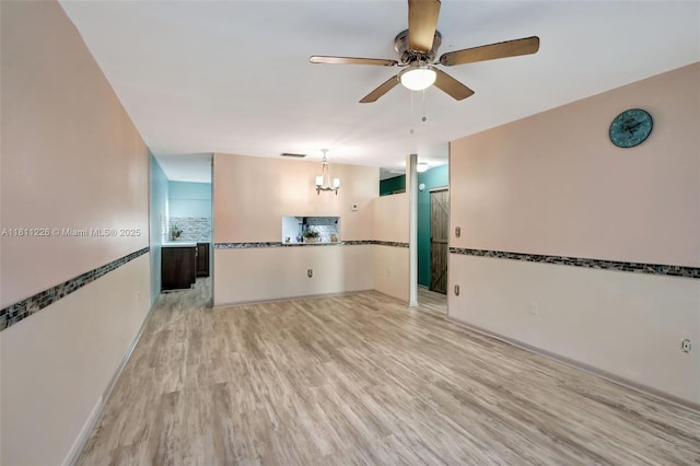 2001 Seagrape Ave, Pembroke Pines, FL 33026 - spare room with a chandelier, ceiling fan, and light wood-style floors