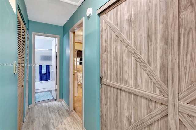 2001 Seagrape Ave, Pembroke Pines, FL 33026 - hallway featuring wood finished floors and baseboards