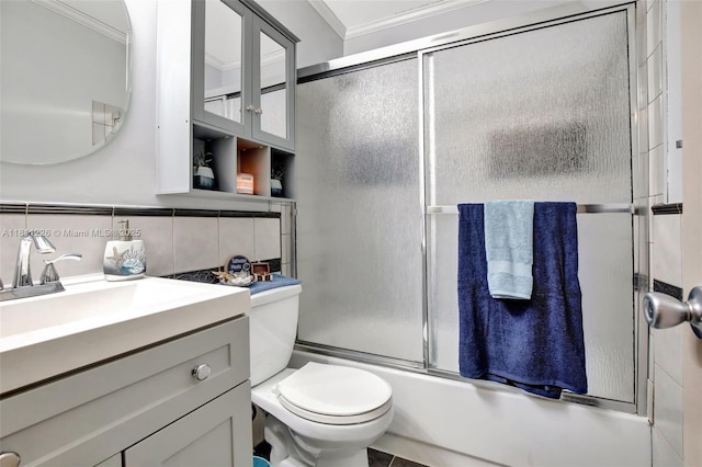 2001 Seagrape Ave, Pembroke Pines, FL 33026 - full bathroom featuring vanity, toilet, shower / bath combination with glass door, and tile walls