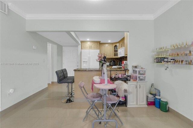 17101 NW 57th Ave Unit 110, Miami Gardens, FL 33055 - dining room with crown molding, light tile patterned floors, baseboards, and recessed lighting