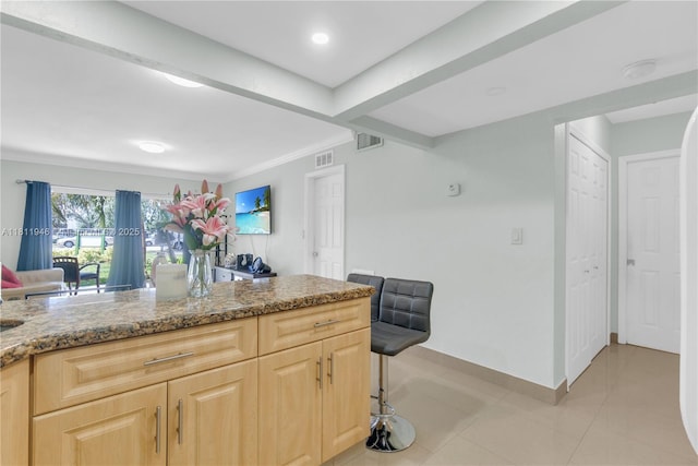 17101 NW 57th Ave Unit 110, Miami Gardens, FL 33055 - kitchen featuring light brown cabinetry, stone countertops, baseboards, and recessed lighting