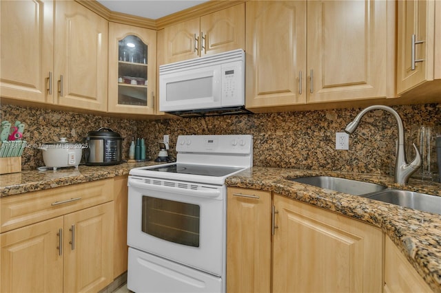 17101 NW 57th Ave Unit 110, Miami Gardens, FL 33055 - kitchen with white appliances, light brown cabinetry, a sink, tasteful backsplash, and glass insert cabinets