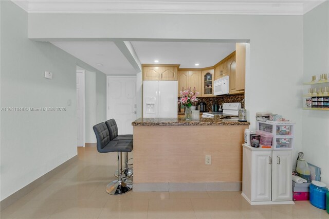 17101 NW 57th Ave Unit 110, Miami Gardens, FL 33055 - kitchen featuring white appliances, glass insert cabinets, dark stone counters, a peninsula, and backsplash