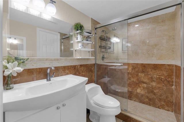 17101 NW 57th Ave Unit 110, Miami Gardens, FL 33055 - full bathroom featuring a shower stall, tile walls, toilet, and vanity