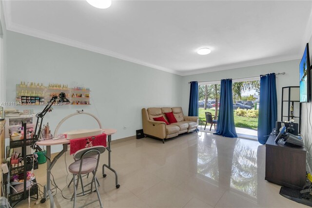 17101 NW 57th Ave Unit 110, Miami Gardens, FL 33055 - living area with tile patterned floors, ornamental molding, and baseboards
