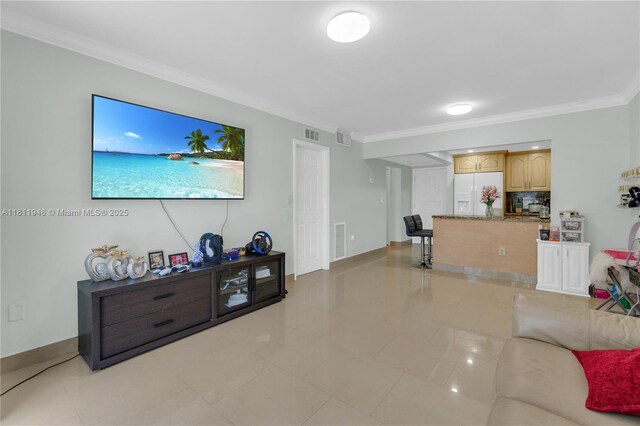 17101 NW 57th Ave Unit 110, Miami Gardens, FL 33055 - living room with light tile patterned floors, crown molding, and baseboards