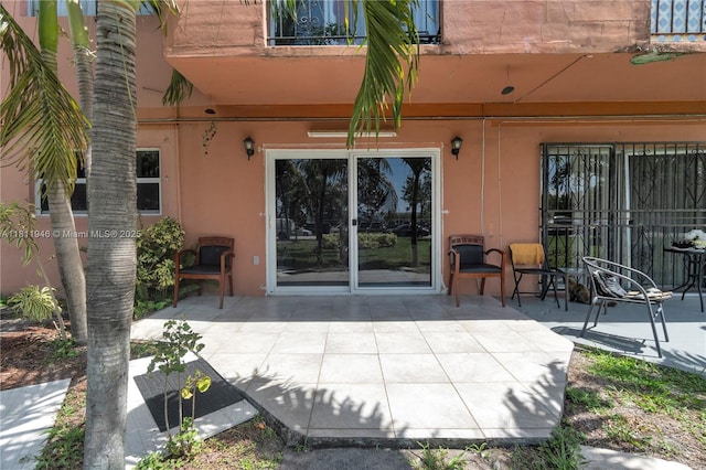 17101 NW 57th Ave Unit 110, Miami Gardens, FL 33055 - entrance to property featuring stucco siding, a patio, and a balcony