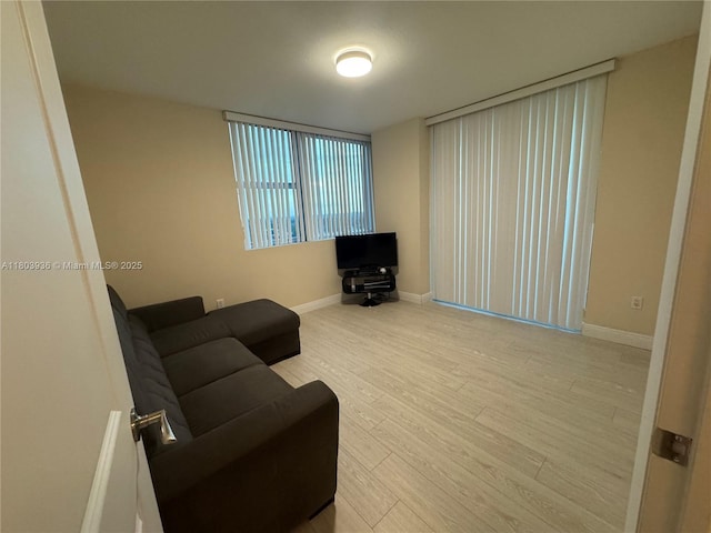 2641 N Flamingo Rd Unit 1001N, Sunrise, FL 33323 - living area featuring wood finished floors and baseboards