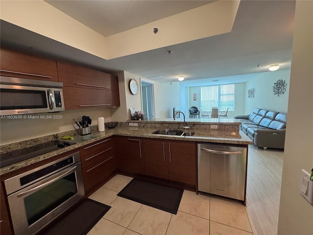 2641 N Flamingo Rd Unit 1001N, Sunrise, FL 33323 - kitchen with stainless steel appliances, a sink, modern cabinets, a peninsula, and open floor plan