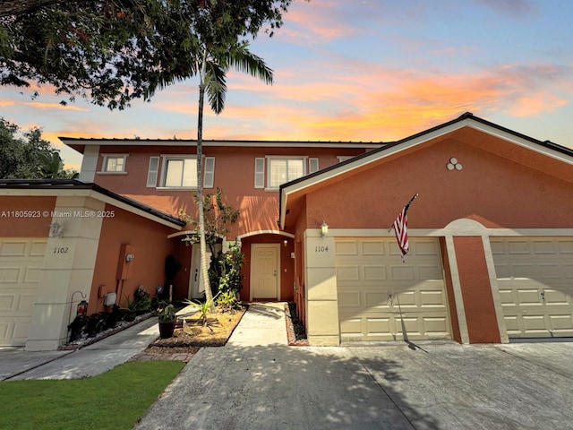 1104 NW 100th Ave, Pembroke Pines, FL 33024 - view of front of house featuring stucco siding, driveway, and an attached garage