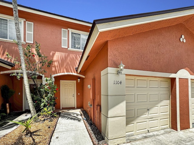 1104 NW 100th Ave, Pembroke Pines, FL 33024 - view of front facade featuring stucco siding and a garage