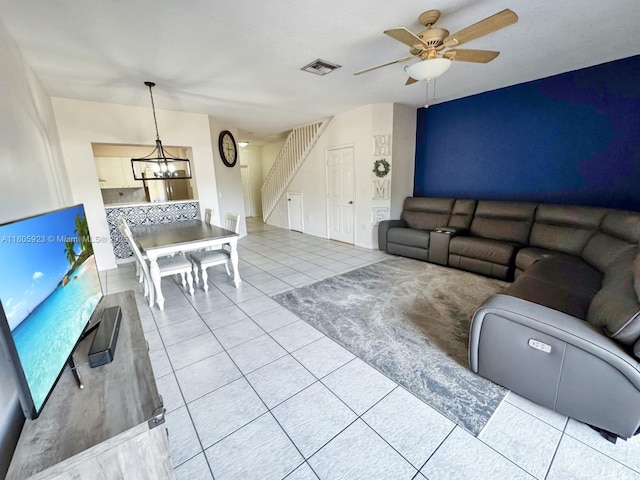 1104 NW 100th Ave, Pembroke Pines, FL 33024 - living area with a chandelier, stairs, light tile patterned floors, and ceiling fan