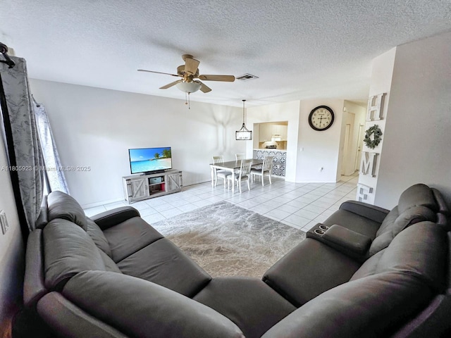1104 NW 100th Ave, Pembroke Pines, FL 33024 - living area with a ceiling fan, light tile patterned flooring, and a textured ceiling