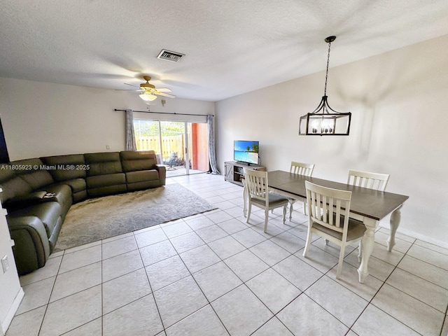 1104 NW 100th Ave, Pembroke Pines, FL 33024 - living area featuring a chandelier, light tile patterned floors, a ceiling fan, and a textured ceiling