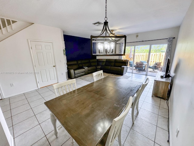 1104 NW 100th Ave, Pembroke Pines, FL 33024 - dining area featuring light tile patterned floors, a chandelier, and baseboards
