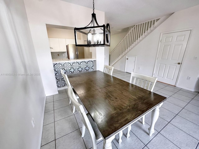 1104 NW 100th Ave, Pembroke Pines, FL 33024 - unfurnished dining area featuring light tile patterned floors, stairs, a chandelier, and baseboards