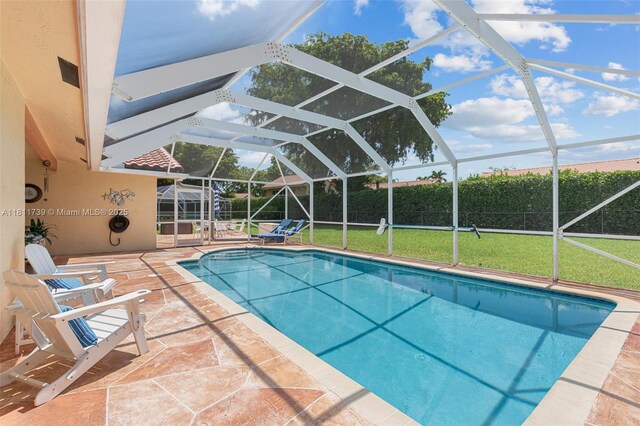 9703 NW 20th St, Coral Springs, FL 33071 - view of swimming pool featuring a patio area and a lanai