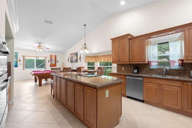 9703 NW 20th St, Coral Springs, FL 33071 - kitchen featuring stainless steel dishwasher, billiards, lofted ceiling, a center island, and tasteful backsplash