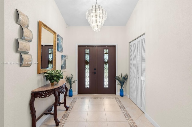 9703 NW 20th St, Coral Springs, FL 33071 - foyer entrance with a chandelier, inlaid floor details, and light tile patterned floors