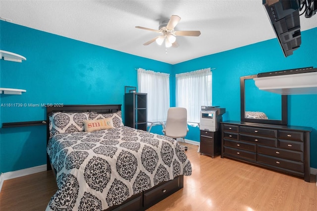 9703 NW 20th St, Coral Springs, FL 33071 - bedroom featuring wood finished floors, a ceiling fan, and a textured ceiling