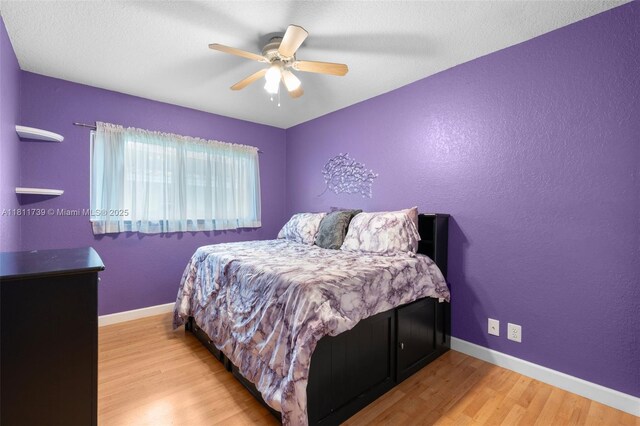 9703 NW 20th St, Coral Springs, FL 33071 - bedroom with wood finished floors and a ceiling fan