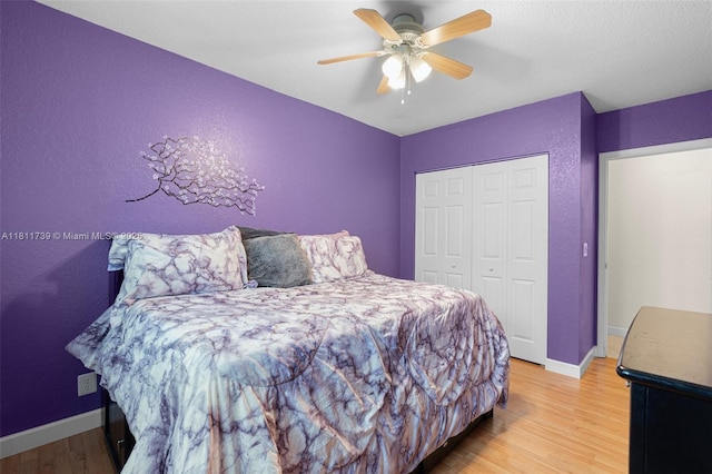9703 NW 20th St, Coral Springs, FL 33071 - bedroom with a closet, wood finished floors, a textured wall, and a ceiling fan