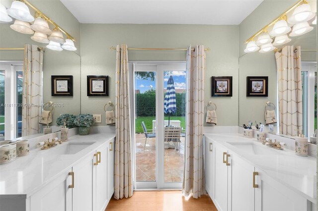 9703 NW 20th St, Coral Springs, FL 33071 - full bath with two vanities and wood finished floors