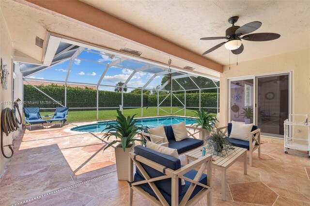 9703 NW 20th St, Coral Springs, FL 33071 - view of swimming pool with a patio area, glass enclosure, a ceiling fan, an outdoor living space, and a yard