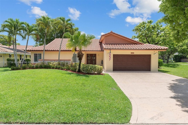 9703 NW 20th St, Coral Springs, FL 33071 - view of front of home with a garage, a tiled roof, stucco siding, a front lawn, and concrete driveway