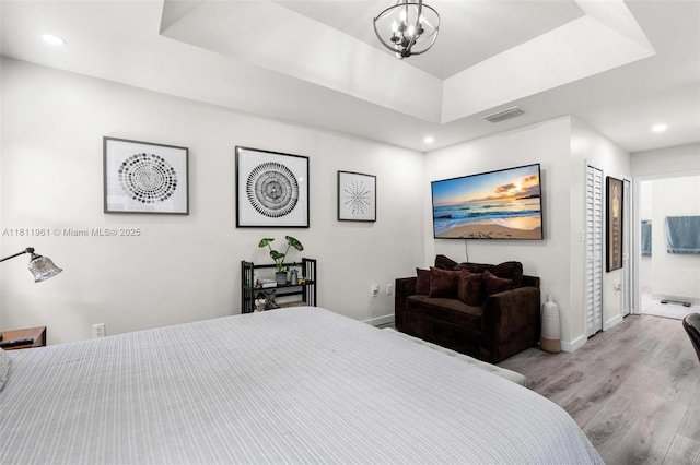 16296 SW 83rd Ln, Miami, FL 33193 - bedroom with baseboards, wood finished floors, recessed lighting, a raised ceiling, and a chandelier