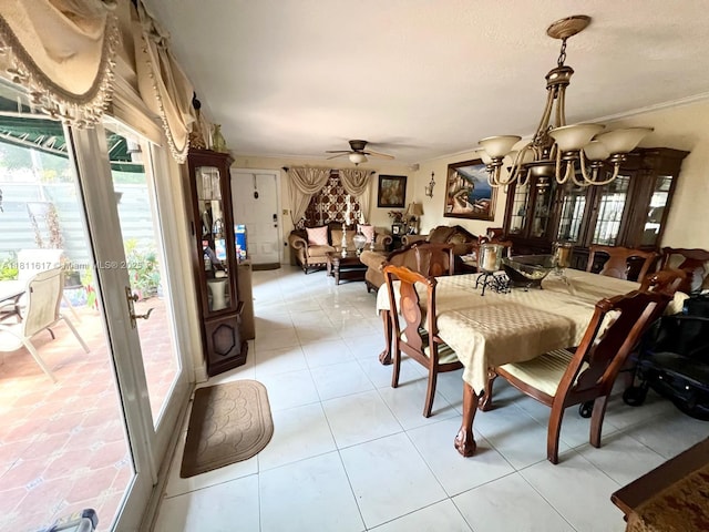14362 SW 96th Ln, Miami, FL 33186 - dining space featuring a chandelier, ornamental molding, ceiling fan, and light tile patterned floors