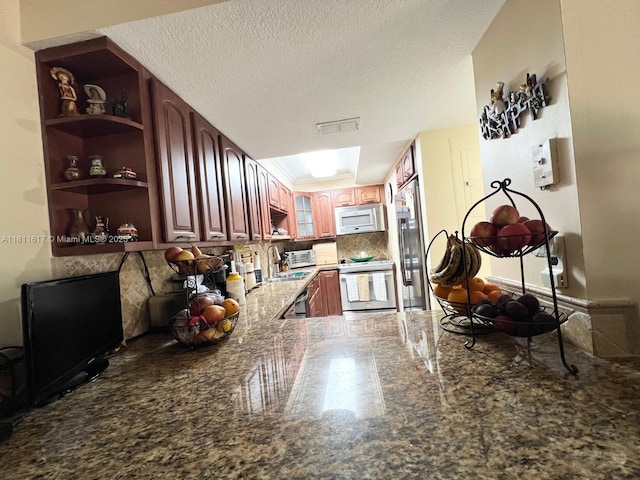 14362 SW 96th Ln, Miami, FL 33186 - kitchen featuring stainless steel appliances, open shelves, granite floors, a sink, and dark stone counters