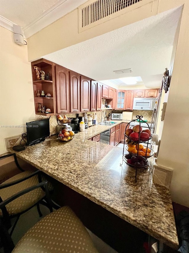 14362 SW 96th Ln, Miami, FL 33186 - kitchen featuring white microwave, a sink, crown molding, stainless steel dishwasher, and a peninsula