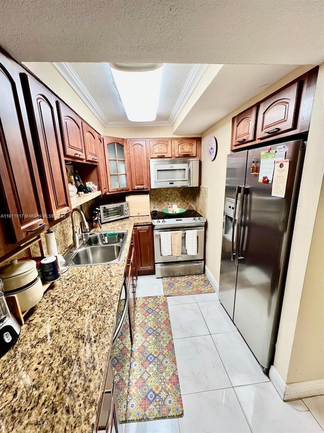 14362 SW 96th Ln, Miami, FL 33186 - kitchen featuring stainless steel appliances, a sink, a textured ceiling, a tray ceiling, and tasteful backsplash