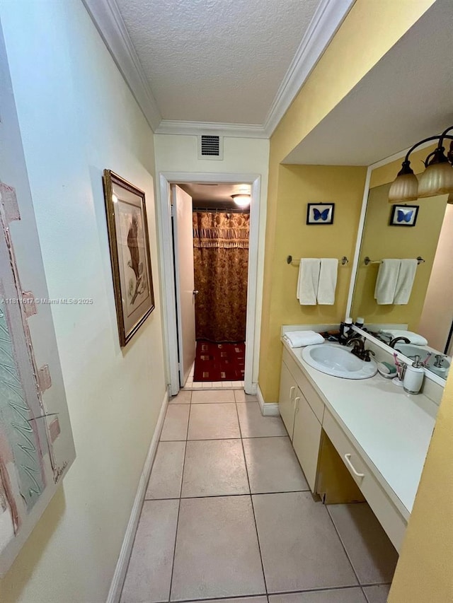 14362 SW 96th Ln, Miami, FL 33186 - full bath with a textured ceiling, vanity, tile patterned floors, baseboards, and ornamental molding