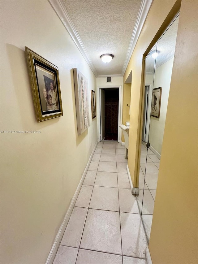 14362 SW 96th Ln, Miami, FL 33186 - hallway featuring crown molding, a textured ceiling, light tile patterned floors, and baseboards