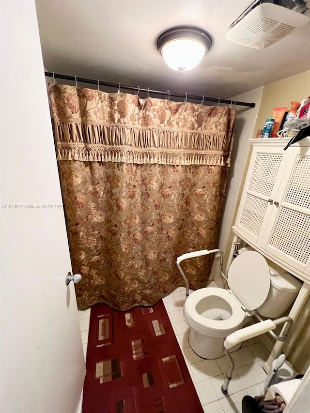 14362 SW 96th Ln, Miami, FL 33186 - bathroom featuring tile patterned flooring, toilet, and curtained shower