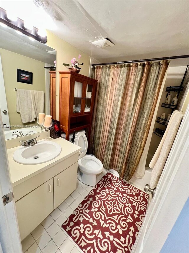 14362 SW 96th Ln, Miami, FL 33186 - full bathroom with tile patterned flooring, vanity, toilet, and shower / bath combo with shower curtain